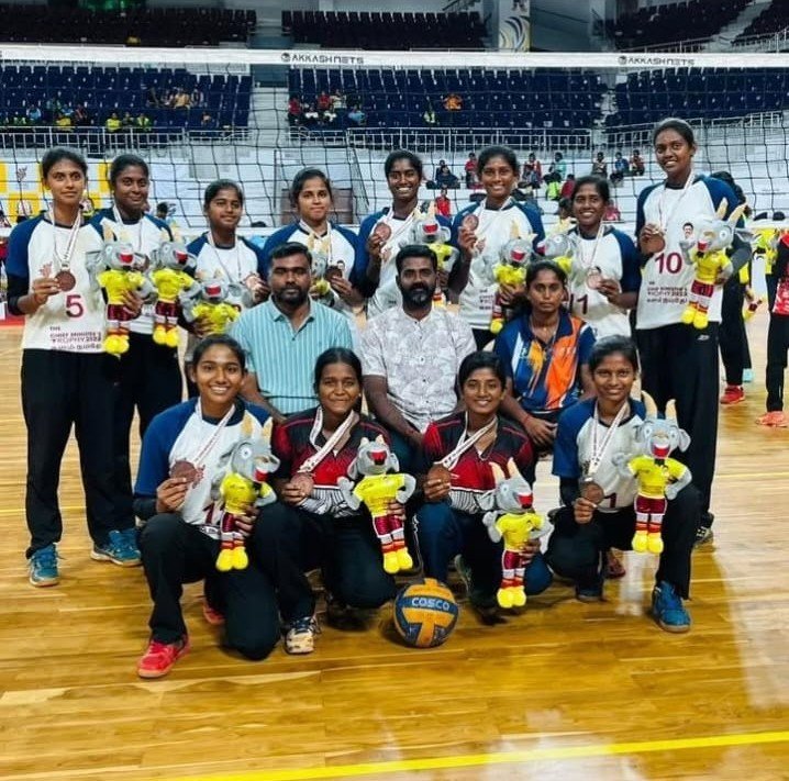 PKR Arts College for Women Volleyball Team celebrating their Bronze medal win at the Chief Minister’s Trophy 2023–2024 with coaches and awards