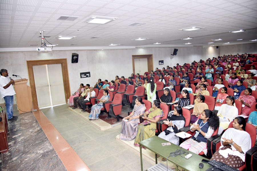 College seminar with students listening to a speaker in auditorium